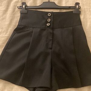 Black Satin High Waisted Pleated Shorts with Rhinestone Decorative Buttons.